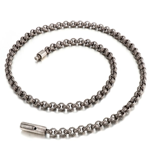 Detailed view of silver stainless steel keel chain with vintage clasp on white surface