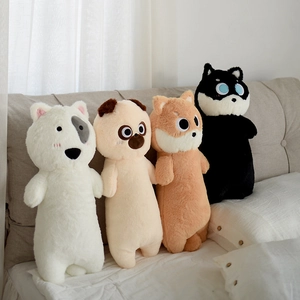 Detailed view of long animal plush pillow skins featuring dog and cat designs on a bed