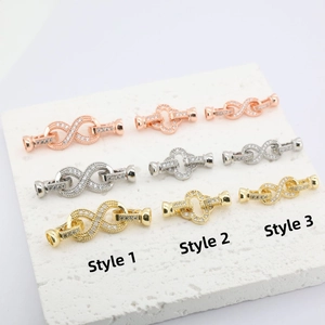 Macro shot of 18K gold plated infinity jewelry clasps with micro-pave cubic zirconia