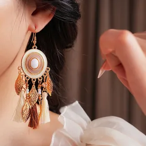 Vintage bohemian tassel drop earrings with gold leaves and opal stone accents