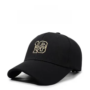 Detail of black baseball cap featuring premium gold 10 ONWARD embroidery on breathable fabric