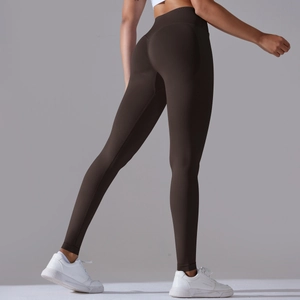 Detail view of coffee brown seamless yoga leggings showing high waist and peach lift effect