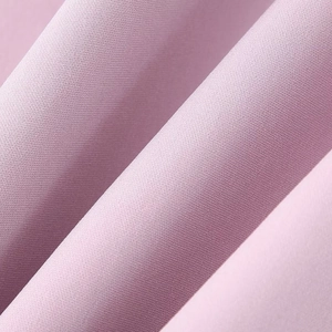 Sweet pink strapless mini dress with detailed fabric texture and bow waist feature