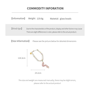 Detail view of long glass bead necklace with tassels and specific size measurements