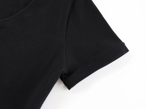 Macro shot of neckline stitching on a black slim-fit T-shirt with premium knit texture