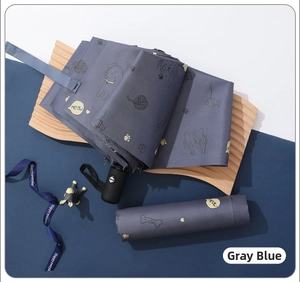 Detail of grey blue automatic folding umbrella with cartoon pet prints and matching pouch