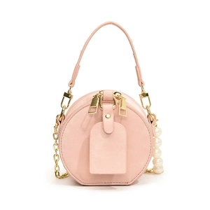 Mini sac rond rose pour enfants avec bandoulière en perles et double zip doré élégant