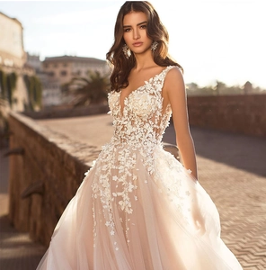 Detailed view of intricate floral lace embroidery and sequins on a bridal gown bodice