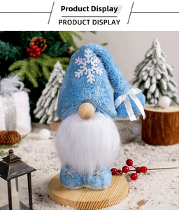 Detail of light blue Christmas gnome with snowflake embroidery and wooden base stand
