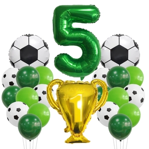 Soccer party set detail with green number 5, champion trophy and football foil balloons