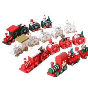 Miniature wooden Christmas train sets with snowmen and Santa Claus for festive table decor
