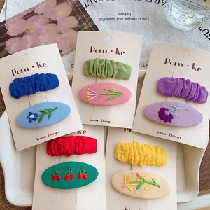 Five pairs of colorful embroidered floral hair clips with macaron tone fabric finish