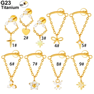 G23 titanium gold piercing studs set with zircon charms including butterfly and heart