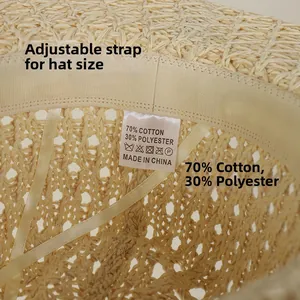 Detail of beige straw hat interior with adjustable drawstring and cotton sweatband