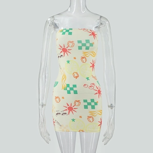 Detail of slim fit strapless mini dress featuring vibrant cartoon patterns on yellow fabric