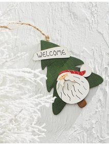 Close-up of wooden Christmas tree ornament with Santa motif and Welcome sign