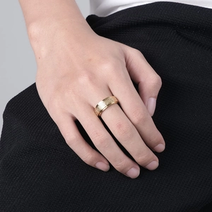 Golden stainless steel Celtic knot spinner ring for anxiety relief on finger