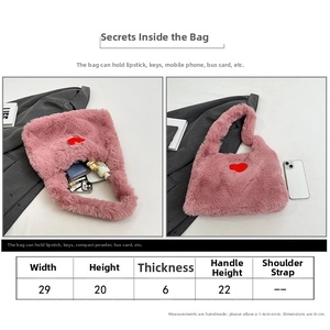 Size guide for pink plush shoulder bag showing 29cm width and heart embroidery detail