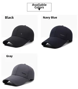 Detail shot of men's baseball caps in black, navy, and grey showing twill fabric texture