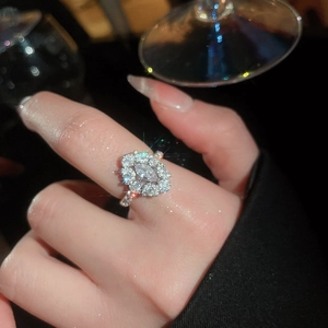 Macro detail of silver marquise cut zircon flower ring showing sparkling brilliant light