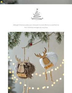 Close-up of reindeer plush ornaments with wooden X-MAS signs on pine branches