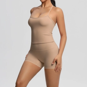 Close-up of seamless light brown yoga set with sports camisole and high waist shorts