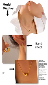 Detail of 18K gold plated U-shaped pendant necklace and earring set on model
