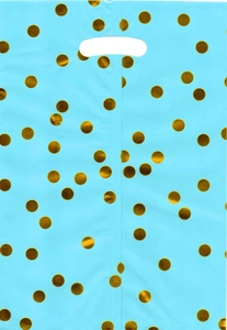 Close-up of blue birthday gift bag with gold foil polka dots and die-cut handle