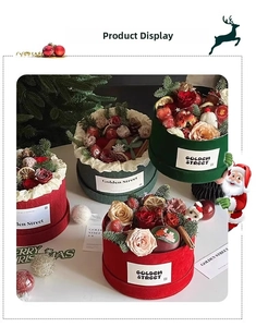 Detail of Christmas flower box with preserved roses, pine cones, and festive ornaments