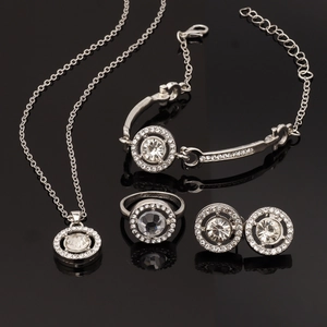 Elegant silver jewelry set with round crystal necklace, bracelet, earrings and ring