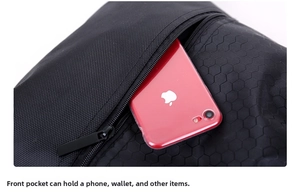 Front zipper pocket of nylon backpack showing storage for phone and accessories