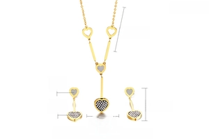 Detailed view of gold stainless steel heart necklace and earring set with shell and zircon