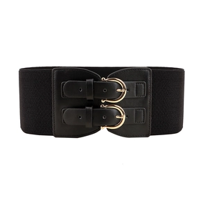 Wide black elastic waist belt for dresses with dual golden horseshoe buckle detail
