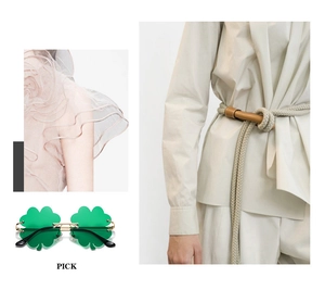 Detail of green clover party sunglasses with rope belt and pink chiffon clothing