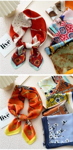 Detail of silk square scarf featuring vibrant floral prints and smooth satin texture