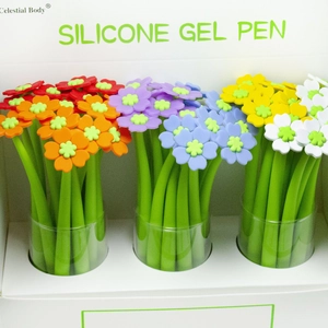 Close-up of assorted colorful flower-shaped silicone gel pens in a white display box