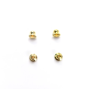 Detailed macro view of 14k gold-filled bell-shaped flower bead caps for DIY jewelry