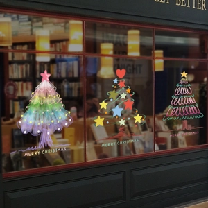 Three colorful Christmas tree window stickers with Merry Christmas text for glass decor