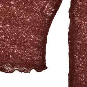 Detailed close-up of reddish-brown lace fabric featuring sheer texture and wavy scallop hem
