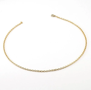 Detail view of a gold stainless steel round link chain necklace with lobster clasp