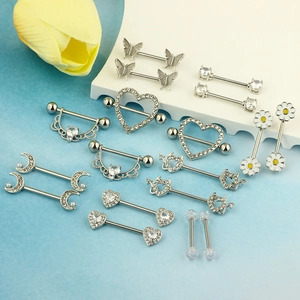 Surgical steel nipple rings collection featuring butterfly, heart, and crescent moon designs