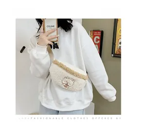 Detail of plush fleece crossbody bag with cartoon sheep embroidery worn by model