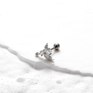 Detail of silver steel earring featuring a butterfly wing design and square zircon stone