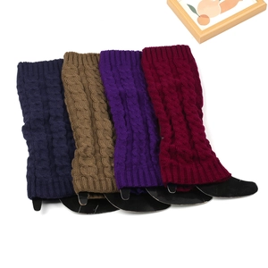 Detailed cable knit pattern on warm leg warmers in navy, coffee, purple, and burgundy