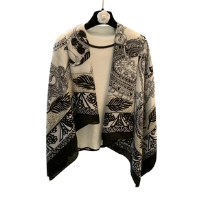 Retro black and white patterned silk scarf shawl hanging on a floral hanger on white base