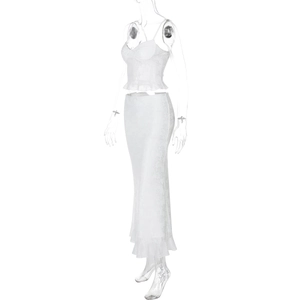 Detailed close-up of white lace floral print fabric with ruffled hem on camisole and maxi skirt