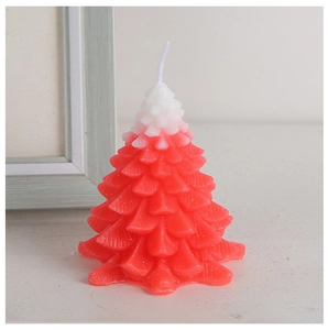 Detailed macro view of a red and white gradient Christmas tree candle with layered texture