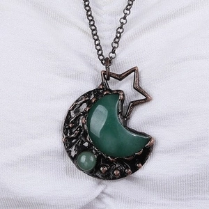 Vintage bronze necklace featuring moon and star pendant with green aventurine gemstone