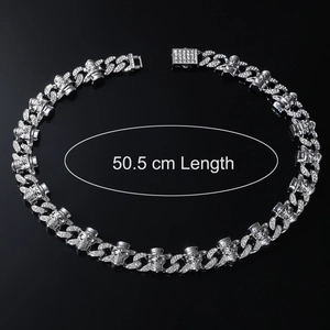 Close-up of 50.5 cm silver iced out skull cuban link chain with diamond box clasp