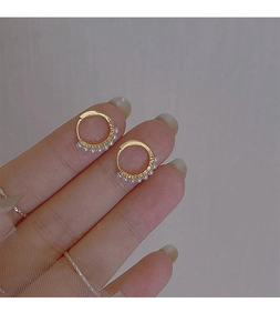 Close-up of gold-plated S925 silver hoop earrings with delicate small white pearls